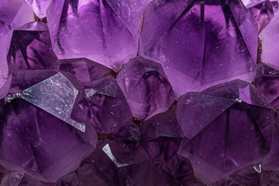 Show exposed Amethyst crystal, not split open stone. Let light passthrough from behind.