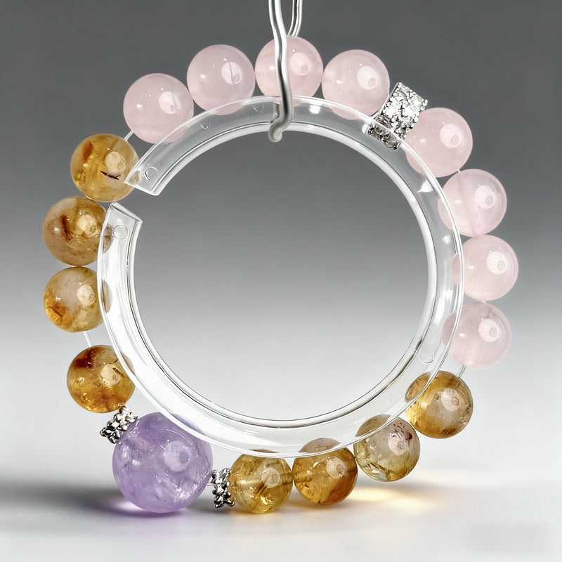 Handcrafted citrine, rose quartz, and amethyst crystal bracelet on a clear background, created to support focus, academic confidence, and mental clarity.