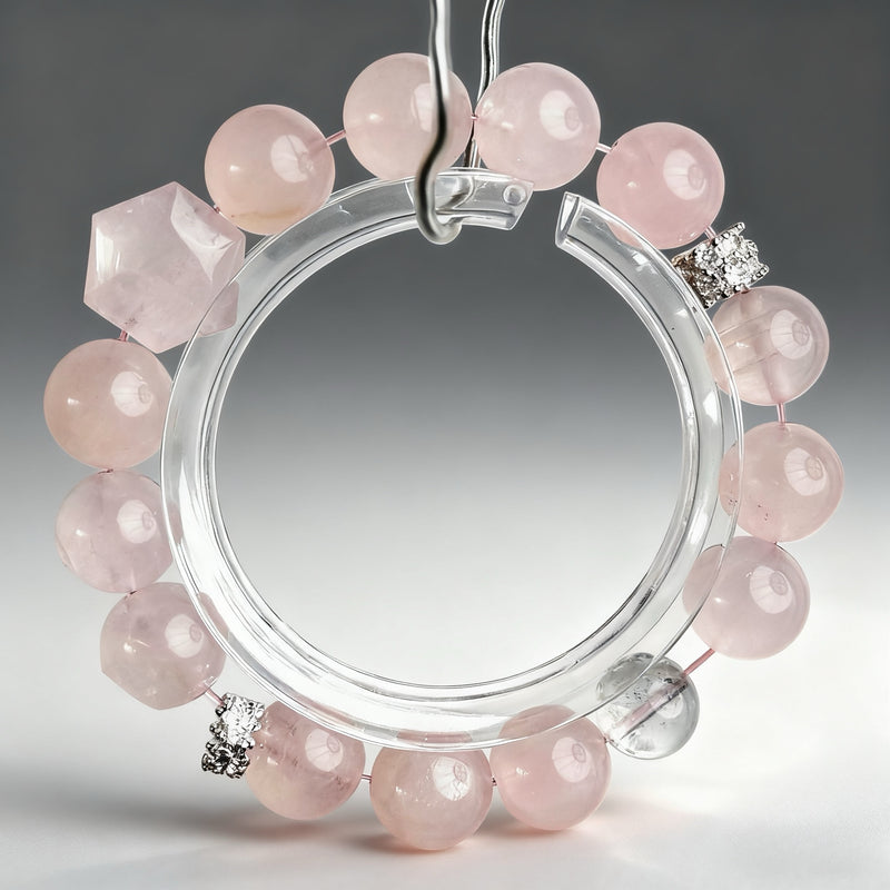 Handcrafted rose quartz and clear quartz crystal bracelet on a clear background, created to support new love, emotional openness, and gentle romantic attraction.