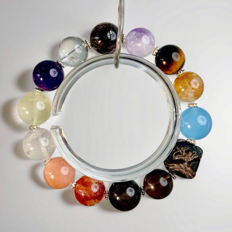 Handcrafted multi-stone crystal bracelet featuring amethyst, citrine, aquamarine, tiger’s eye, smoky quartz, clear quartz, and rutilated quartz on a clear background, created to support full-spectrum balance, vitality, and steady energy regulation.