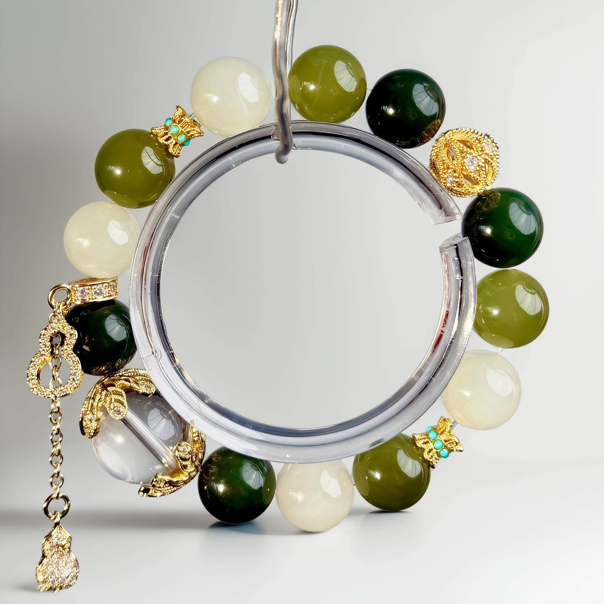 Handcrafted Hetian jade bracelet with quartz, bodhi details, and symbolic infinite bead, embodying movement, continuity, and mindful living.