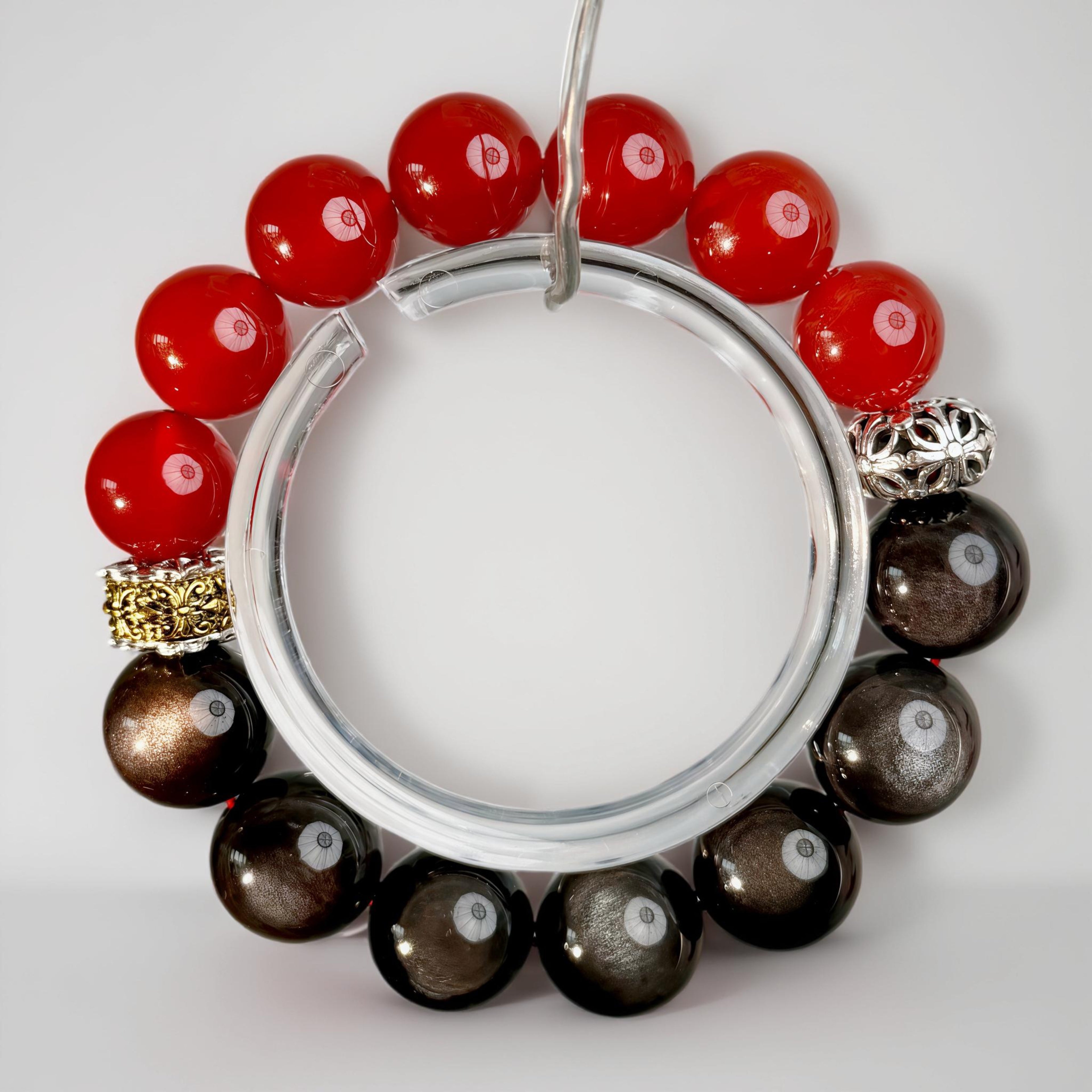 Handcrafted contrast gemstone bracelet featuring vivid red and deep black tones with refined metallic details, embodying strength, control, and grounded energy.